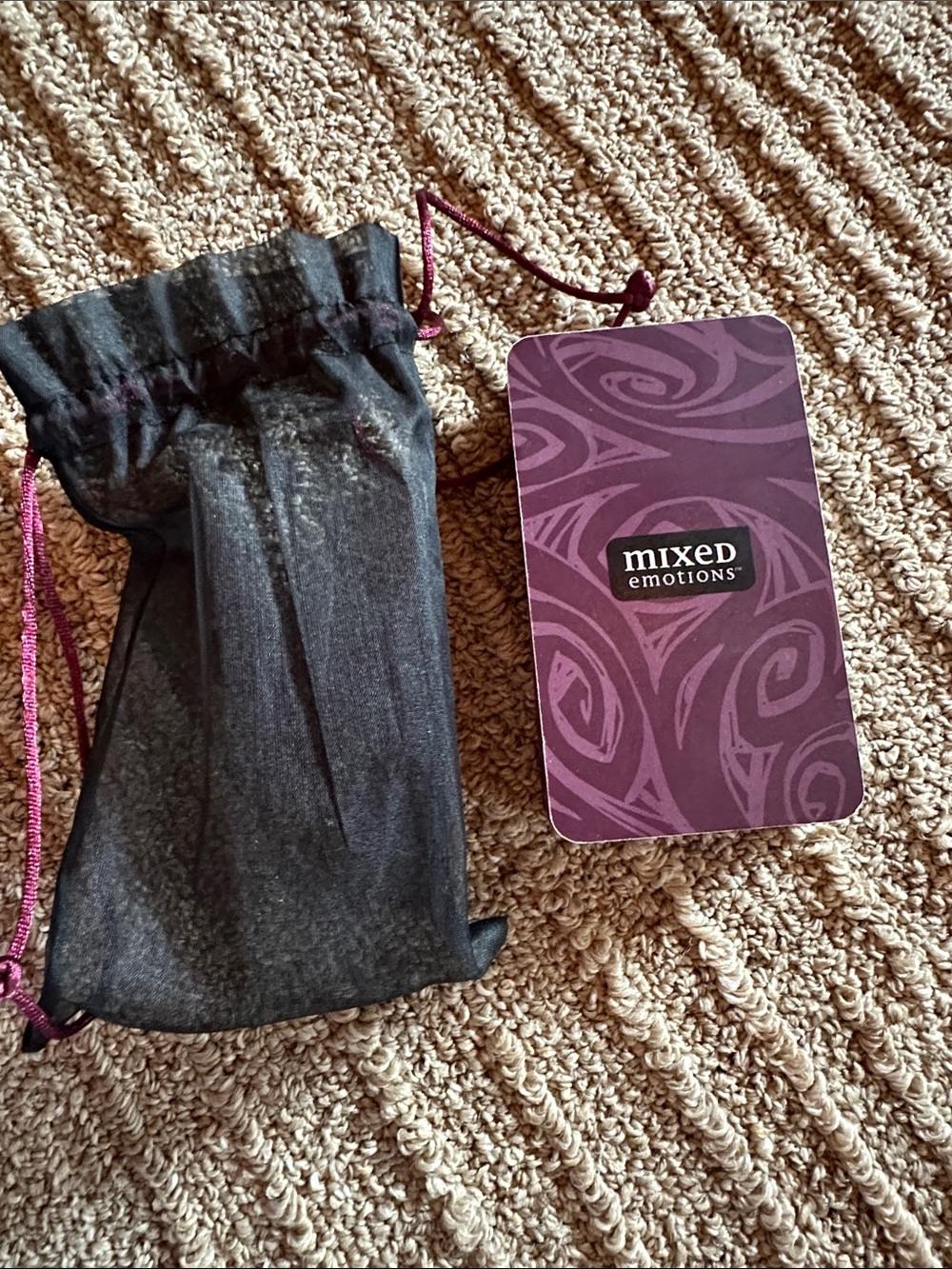 Mixed Emotions Purple Tag with Black Drawstring Pouch